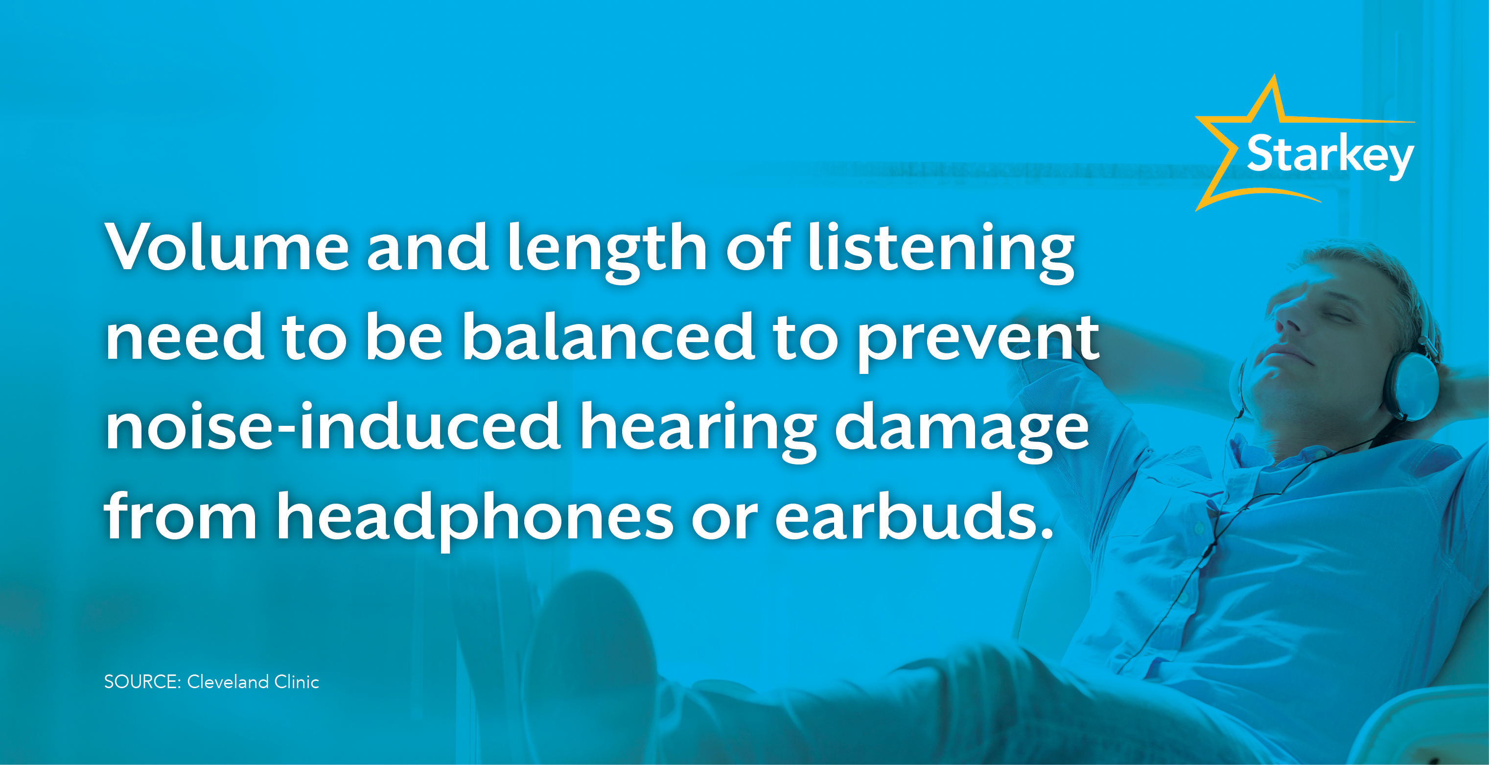 Image of man relaxing at his desk while wearing headphones