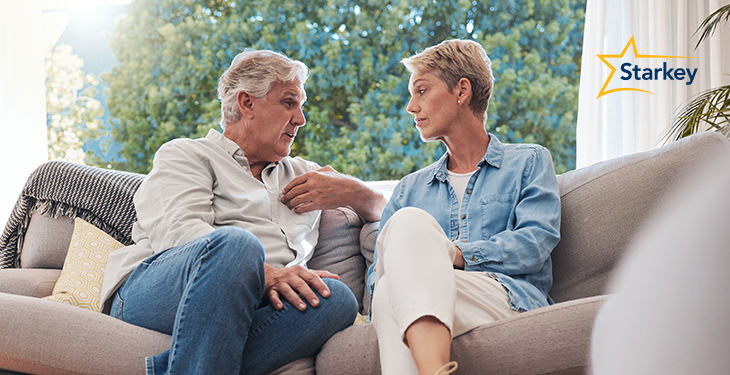 Image of a couple on a couch in deep discussion