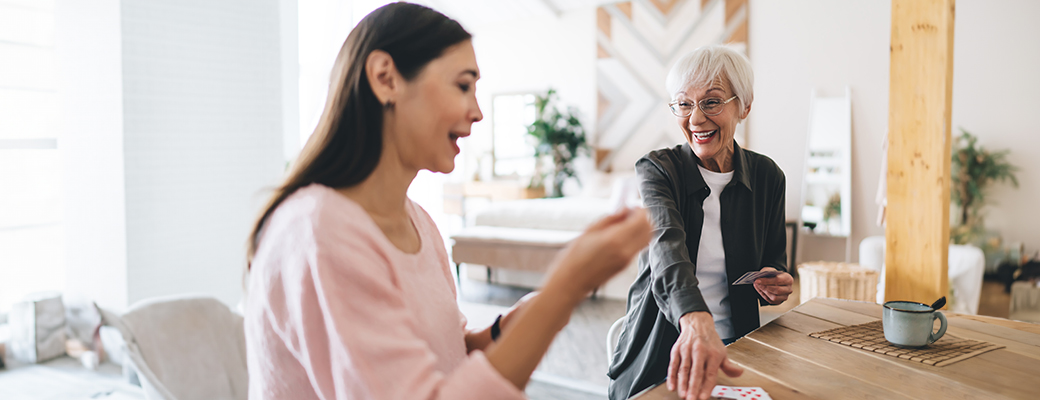 Image of senior woman talking with middle-aged woman