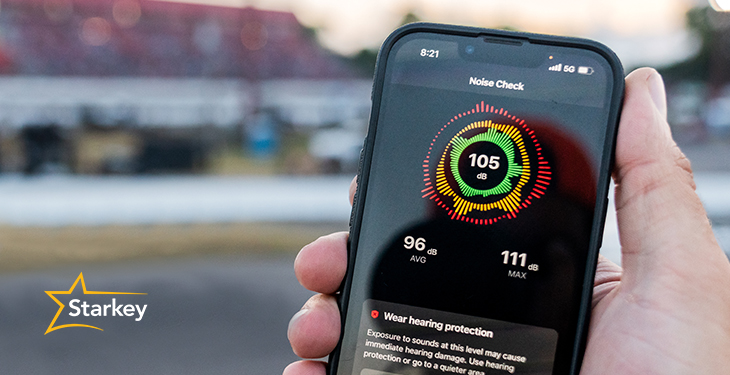 Image of person holding smartphone with SoundCheck Live app open