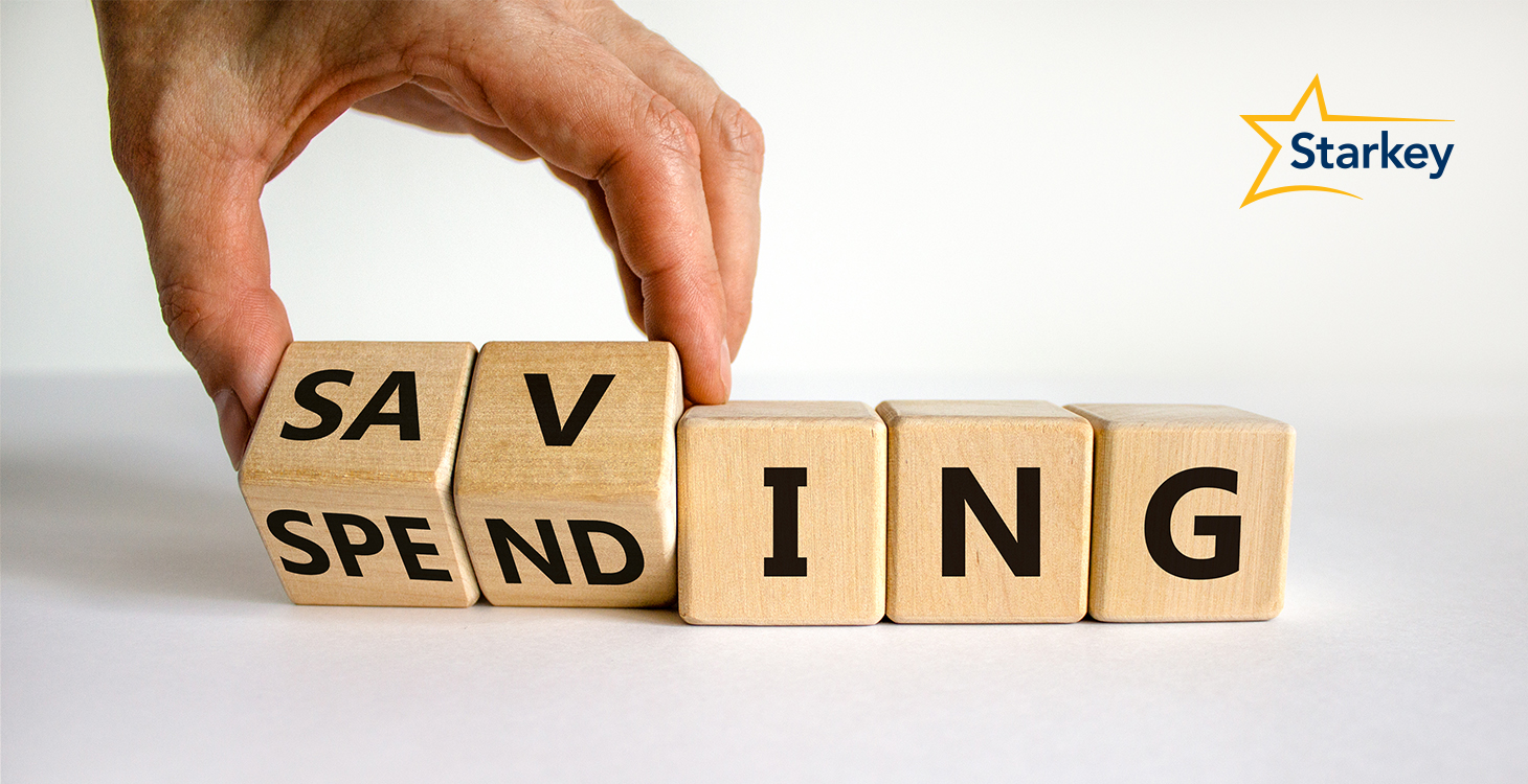 Image of hand moving blocks that say "saving" and "spending"