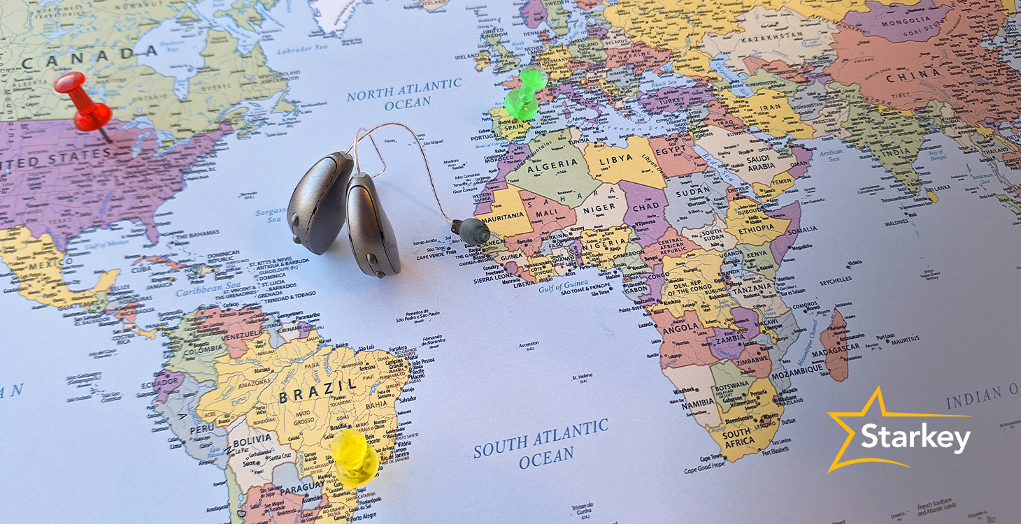 Image of world map with Starkey hearing aids sitting on it